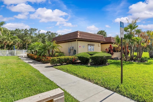 1701 Pinehurst Rd Unit 9G, Dunedin, FL 34698 - view of home's exterior with a tiled roof and stucco siding