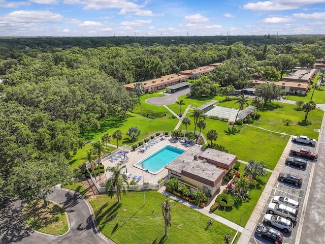 1701 Pinehurst Rd Unit 9G, Dunedin, FL 34698 - aerial view of a pool area and a heavily wooded area