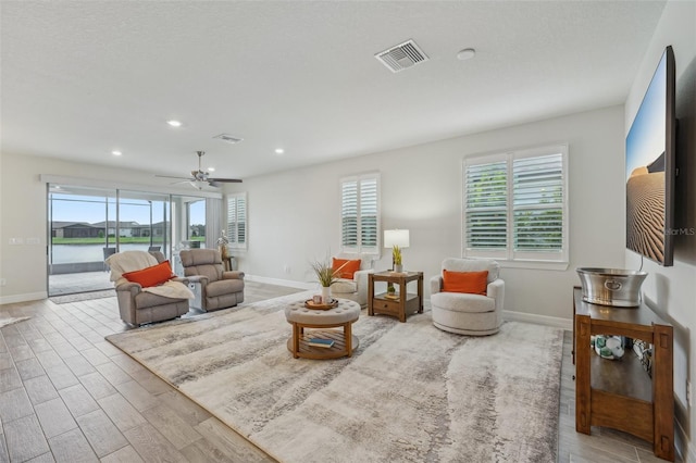 19183 Coastal Shore Ter, Land O Lakes, FL 34638 - living area with wood finished floors, baseboards, recessed lighting, and a ceiling fan