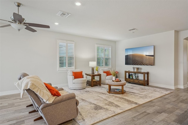 19183 Coastal Shore Ter, Land O Lakes, FL 34638 - living room featuring wood finished floors, baseboards, ceiling fan, and recessed lighting