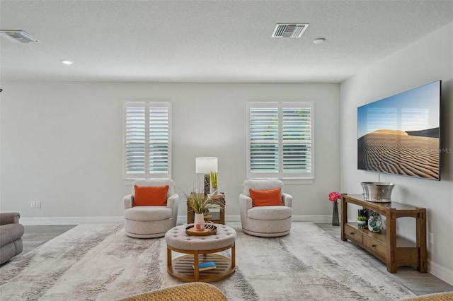 19183 Coastal Shore Ter, Land O Lakes, FL 34638 - living room with baseboards and recessed lighting