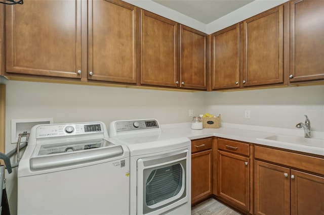 19183 Coastal Shore Ter, Land O Lakes, FL 34638 - laundry area with washer and dryer and cabinet space