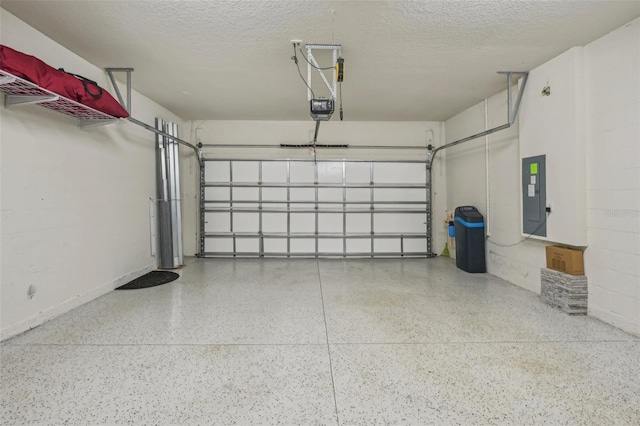 19183 Coastal Shore Ter, Land O Lakes, FL 34638 - garage featuring electric panel and a garage door opener