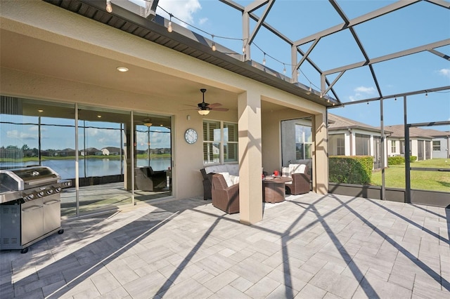 19183 Coastal Shore Ter, Land O Lakes, FL 34638 - view of patio / terrace with an outdoor hangout area, a water view, glass enclosure, ceiling fan, and grilling area