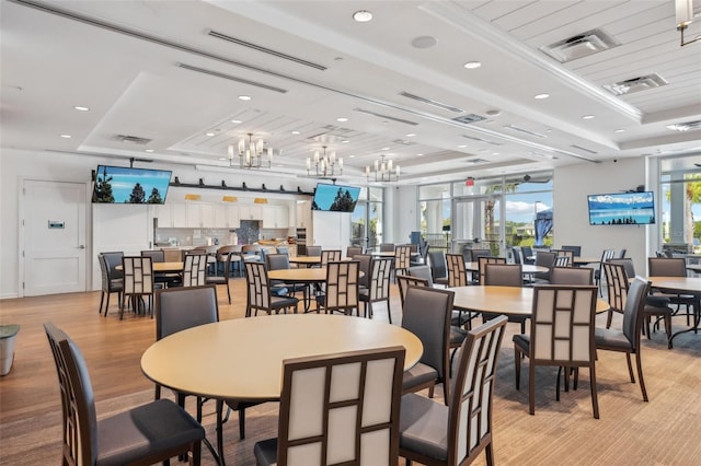 19183 Coastal Shore Ter, Land O Lakes, FL 34638 - dining space featuring a tray ceiling, recessed lighting, and light wood-style flooring