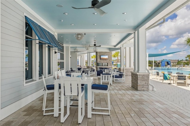 19183 Coastal Shore Ter, Land O Lakes, FL 34638 - wooden terrace with ceiling fan and outdoor dining space