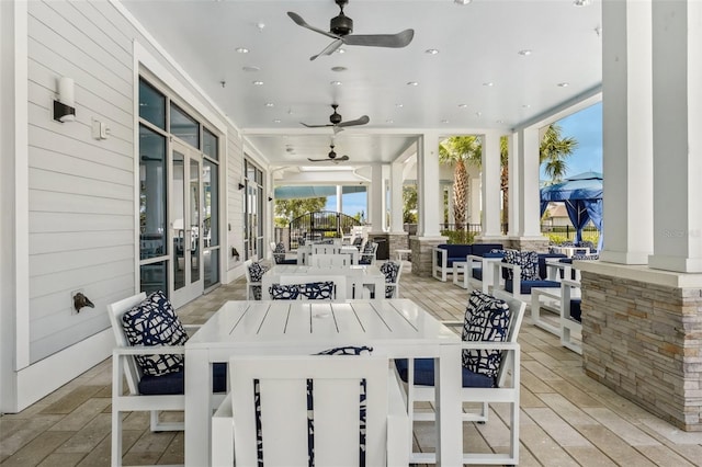 19183 Coastal Shore Ter, Land O Lakes, FL 34638 - wooden terrace with a ceiling fan and outdoor dining area