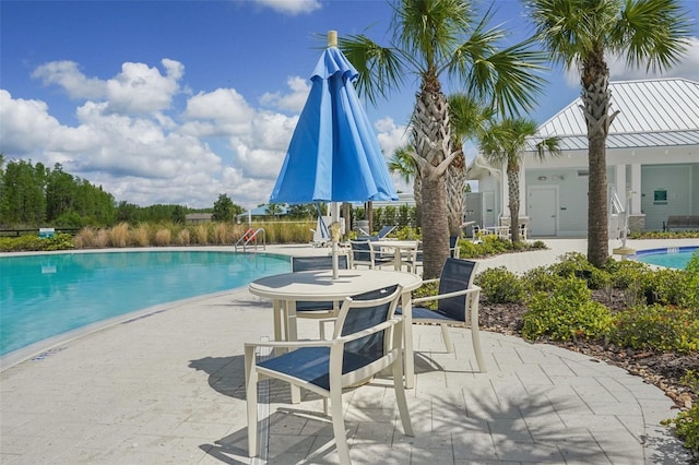 19183 Coastal Shore Ter, Land O Lakes, FL 34638 - community pool with a patio