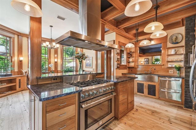 3112 W Wallcraft Ave, Tampa, FL 33611 - kitchen featuring high end stainless steel range, island range hood, a sink, open shelves, and light wood finished floors