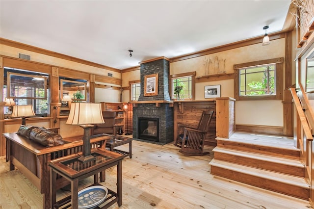 3112 W Wallcraft Ave, Tampa, FL 33611 - living area featuring healthy amount of natural light, wood-type flooring, stairs, and ornamental molding