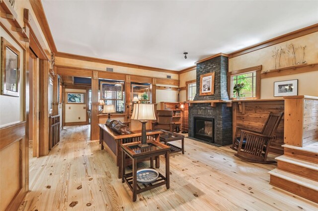 3112 W Wallcraft Ave, Tampa, FL 33611 - living area featuring hardwood / wood-style flooring, ornamental molding, a fireplace, and wooden walls
