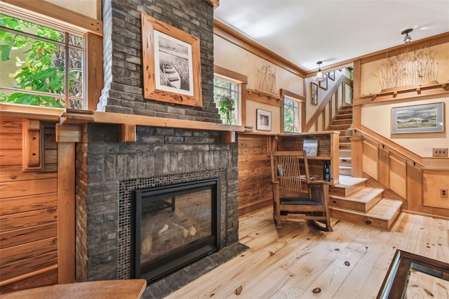 3112 W Wallcraft Ave, Tampa, FL 33611 - stairs with hardwood / wood-style flooring, a fireplace, and ornamental molding
