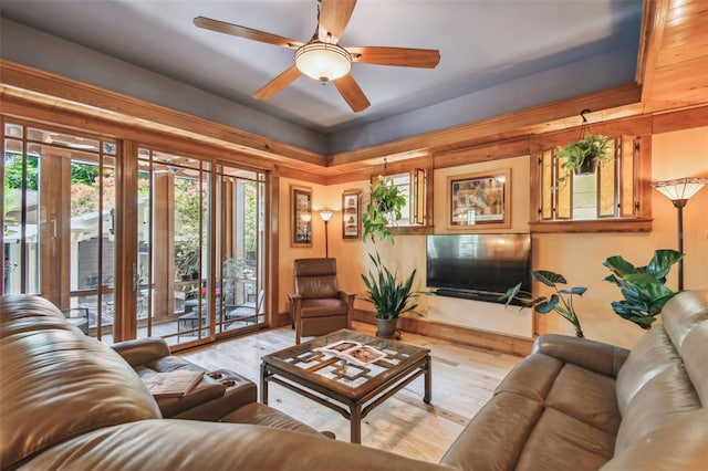 3112 W Wallcraft Ave, Tampa, FL 33611 - living area featuring ceiling fan, wood finished floors, and baseboards