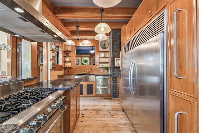 3112 W Wallcraft Ave, Tampa, FL 33611 - kitchen featuring stainless steel appliances, exhaust hood, a sink, light wood-style flooring, and open shelves