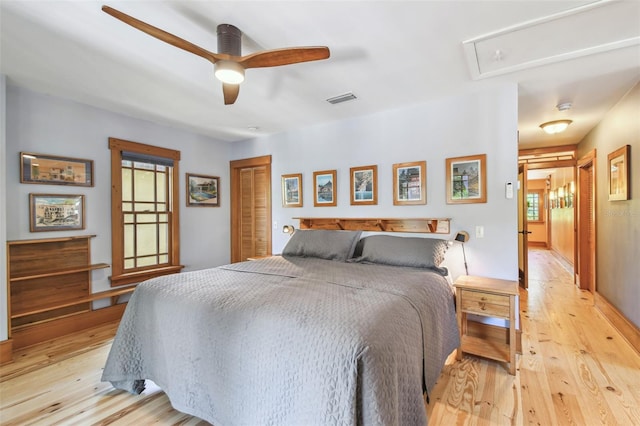 3112 W Wallcraft Ave, Tampa, FL 33611 - bedroom with light wood-style floors, attic access, a closet, and a ceiling fan