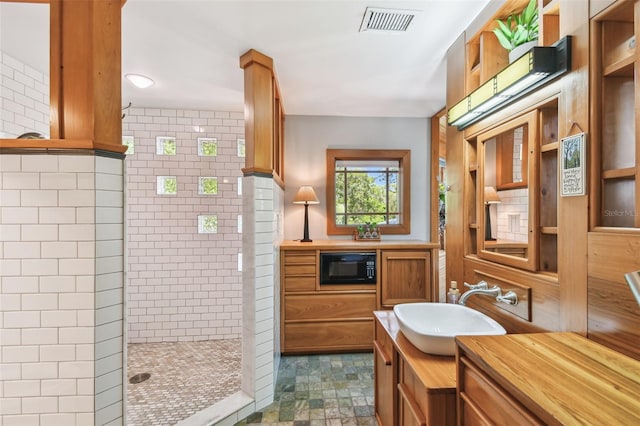 3112 W Wallcraft Ave, Tampa, FL 33611 - bathroom featuring walk in shower and vanity