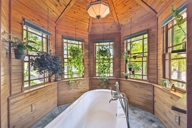 3112 W Wallcraft Ave, Tampa, FL 33611 - bathroom featuring wooden walls, lofted ceiling, wood ceiling, and a freestanding tub