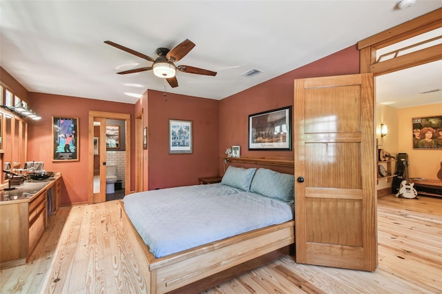 3112 W Wallcraft Ave, Tampa, FL 33611 - bedroom featuring light wood-style floors, ensuite bath, and ceiling fan
