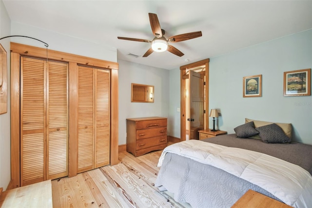 3112 W Wallcraft Ave, Tampa, FL 33611 - bedroom with light wood finished floors, a closet, a ceiling fan, and baseboards