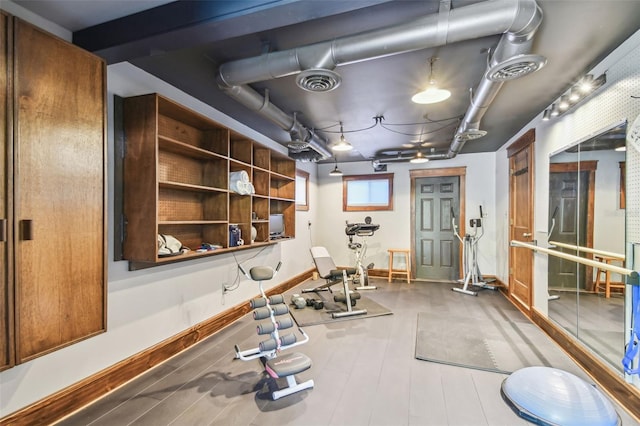 3112 W Wallcraft Ave, Tampa, FL 33611 - exercise room featuring baseboards