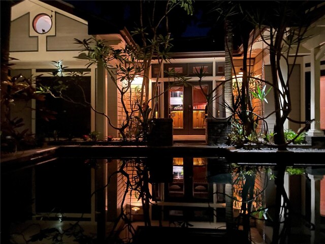 3112 W Wallcraft Ave, Tampa, FL 33611 - back of house at twilight with french doors
