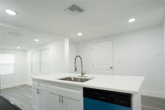 5510 12th St, Zephyrhills, FL 33542 - kitchen featuring dishwashing machine, a sink, baseboards, light wood-type flooring, and recessed lighting