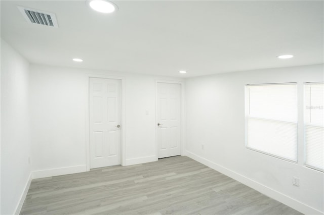5510 12th St, Zephyrhills, FL 33542 - spare room featuring baseboards, recessed lighting, and light wood-style flooring