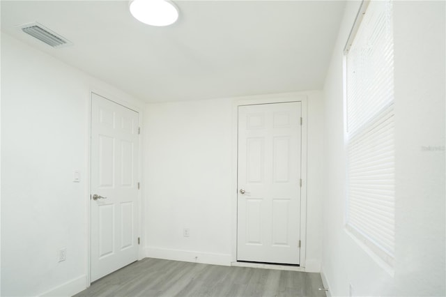 5510 12th St, Zephyrhills, FL 33542 - unfurnished bedroom with light wood-type flooring and baseboards