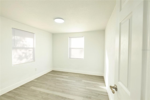 5510 12th St, Zephyrhills, FL 33542 - empty room featuring light wood-style flooring and baseboards