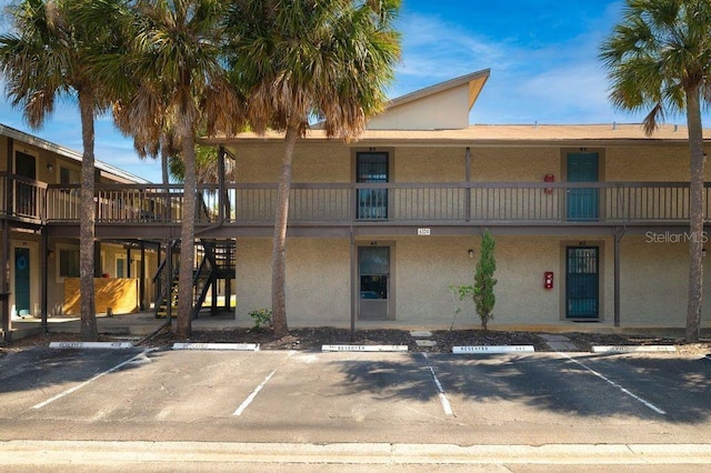 6324 Newtown Cir Unit 24B1, Tampa, FL 33615 - view of property featuring uncovered parking