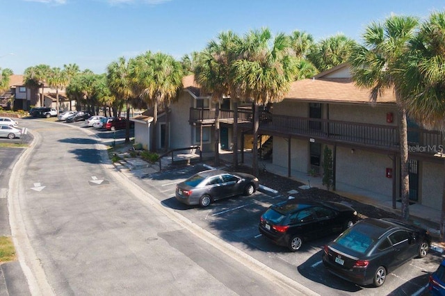 6324 Newtown Cir Unit 24B1, Tampa, FL 33615 - view of asphalt street with curbs, street lights, and a residential view