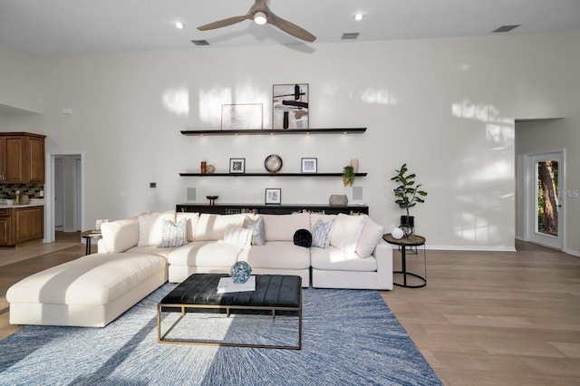 4962 Turtle Creek Trl, Oldsmar, FL 34677 - living room with light wood-type flooring, a ceiling fan, and baseboards