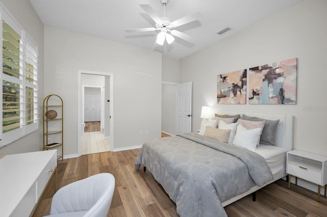 4962 Turtle Creek Trl, Oldsmar, FL 34677 - bedroom with wood finished floors, ceiling fan, and baseboards