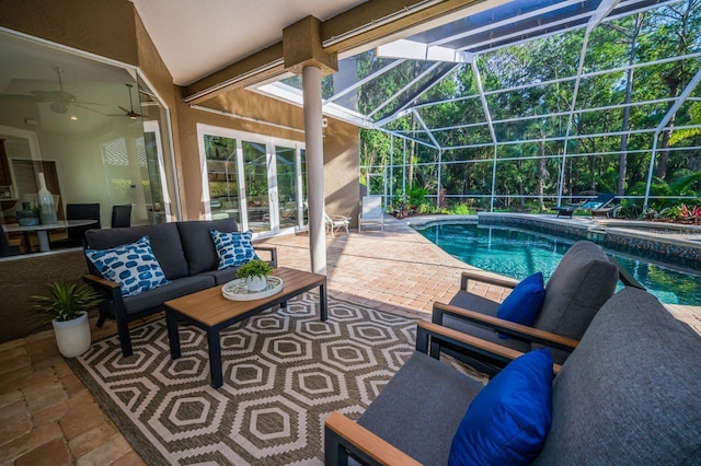 4962 Turtle Creek Trl, Oldsmar, FL 34677 - view of swimming pool featuring an outdoor living space, a patio, a lanai, a ceiling fan, and a pool with connected hot tub