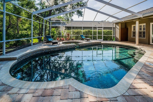 4962 Turtle Creek Trl, Oldsmar, FL 34677 - view of pool featuring a lanai, a patio area, and a pool with connected hot tub