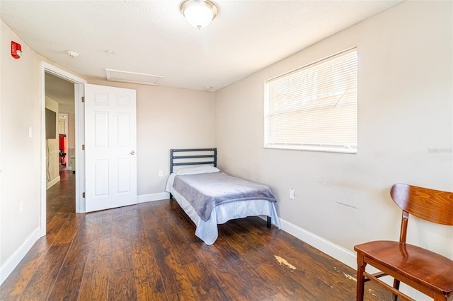 9020 Gray Fox Ln, Port Richey, FL 34668 - bedroom with wood finished floors, baseboards, and attic access