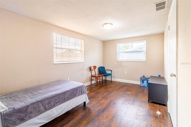 9020 Gray Fox Ln, Port Richey, FL 34668 - bedroom featuring wood finished floors and baseboards