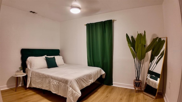 2219 Thrace St, Tampa, FL 33605 - bedroom with light wood finished floors and baseboards