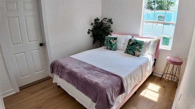 2219 Thrace St, Tampa, FL 33605 - bedroom with wood finished floors and baseboards