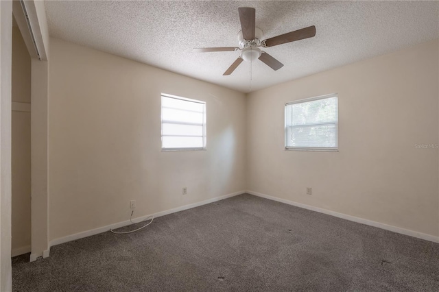 725 2nd Ave NE, Largo, FL 33770 - carpeted spare room with plenty of natural light, a ceiling fan, a textured ceiling, and baseboards