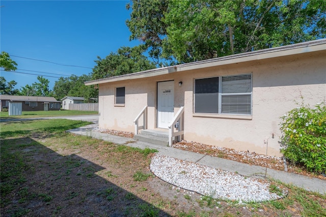 725 2nd Ave NE, Largo, FL 33770 - entrance to property featuring stucco siding