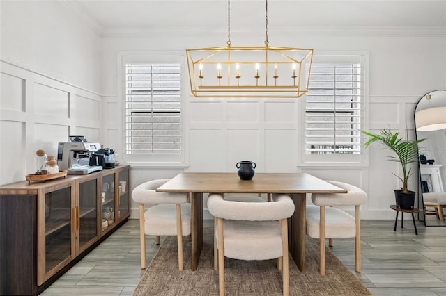 4345 Cadence Loop, Land O Lakes, FL 34638 - dining area with a decorative wall, plenty of natural light, and ornamental molding