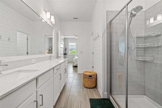 4345 Cadence Loop, Land O Lakes, FL 34638 - ensuite bathroom featuring a shower stall and double vanity