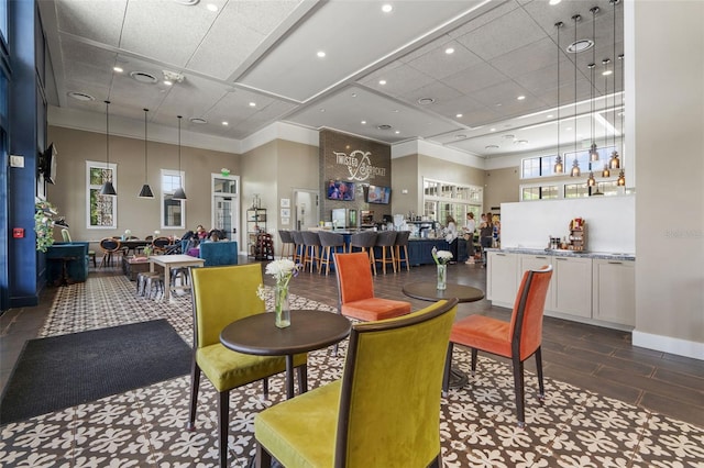 4345 Cadence Loop, Land O Lakes, FL 34638 - dining space featuring a paneled ceiling, a high ceiling, ornamental molding, and baseboards