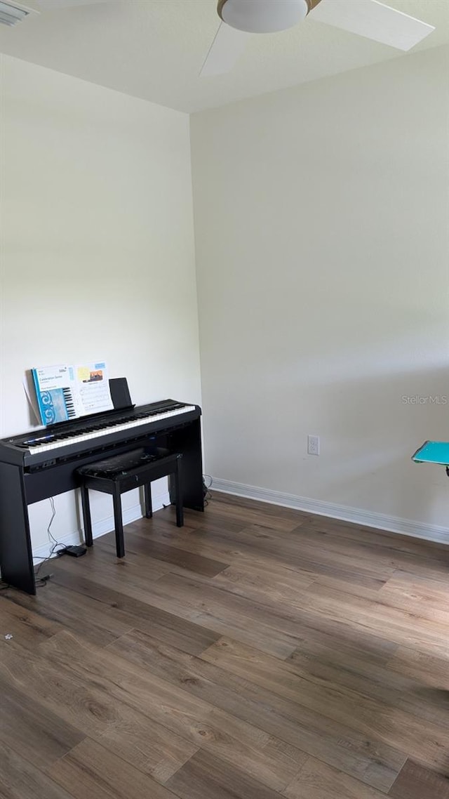 3446 Suncoast Plains Dr, Odessa, FL 33556 - living area with dark wood-style floors and baseboards