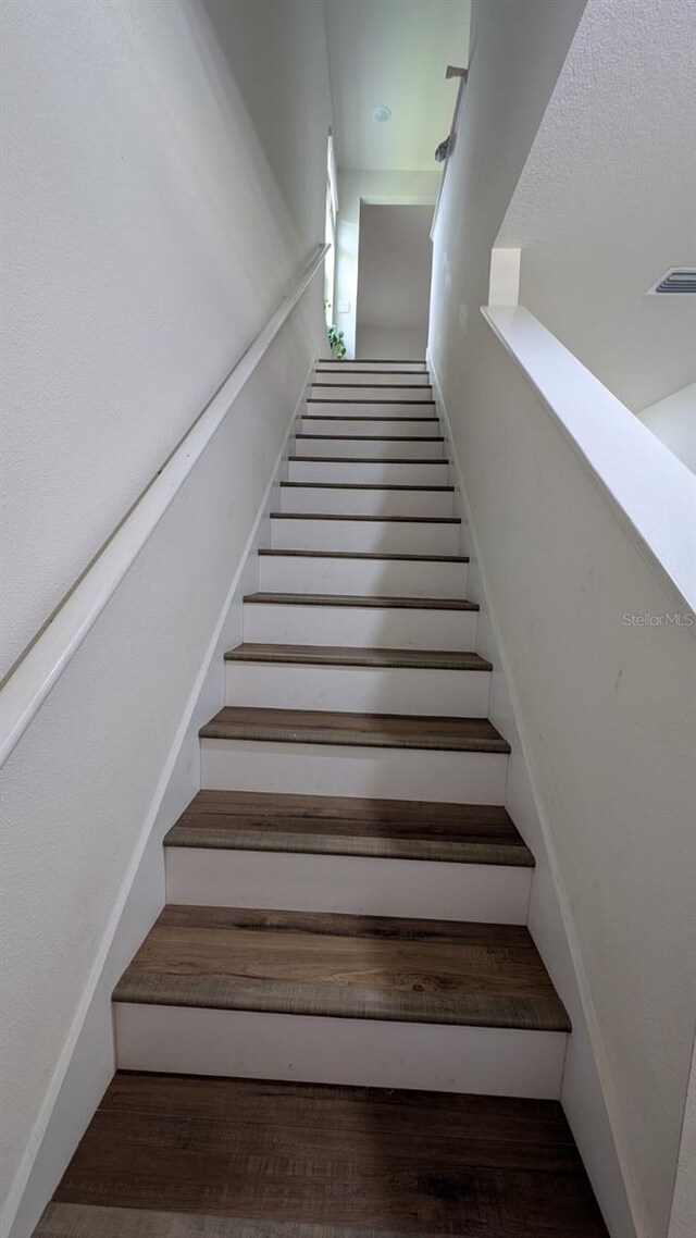 3446 Suncoast Plains Dr, Odessa, FL 33556 - stairs with wood finished floors