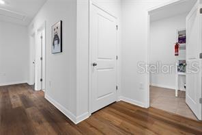 3446 Suncoast Plains Dr, Odessa, FL 33556 - hallway featuring wood finished floors and baseboards