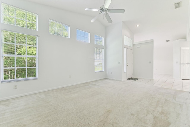1624 Lullwater Ln, Lutz, FL 33549 - empty room with light colored carpet, a ceiling fan, baseboards, and high vaulted ceiling