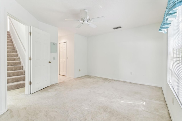 1624 Lullwater Ln, Lutz, FL 33549 - carpeted spare room with stairway, ceiling fan, plenty of natural light, and baseboards