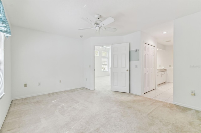 1624 Lullwater Ln, Lutz, FL 33549 - unfurnished room with ceiling fan, light carpet, and baseboards